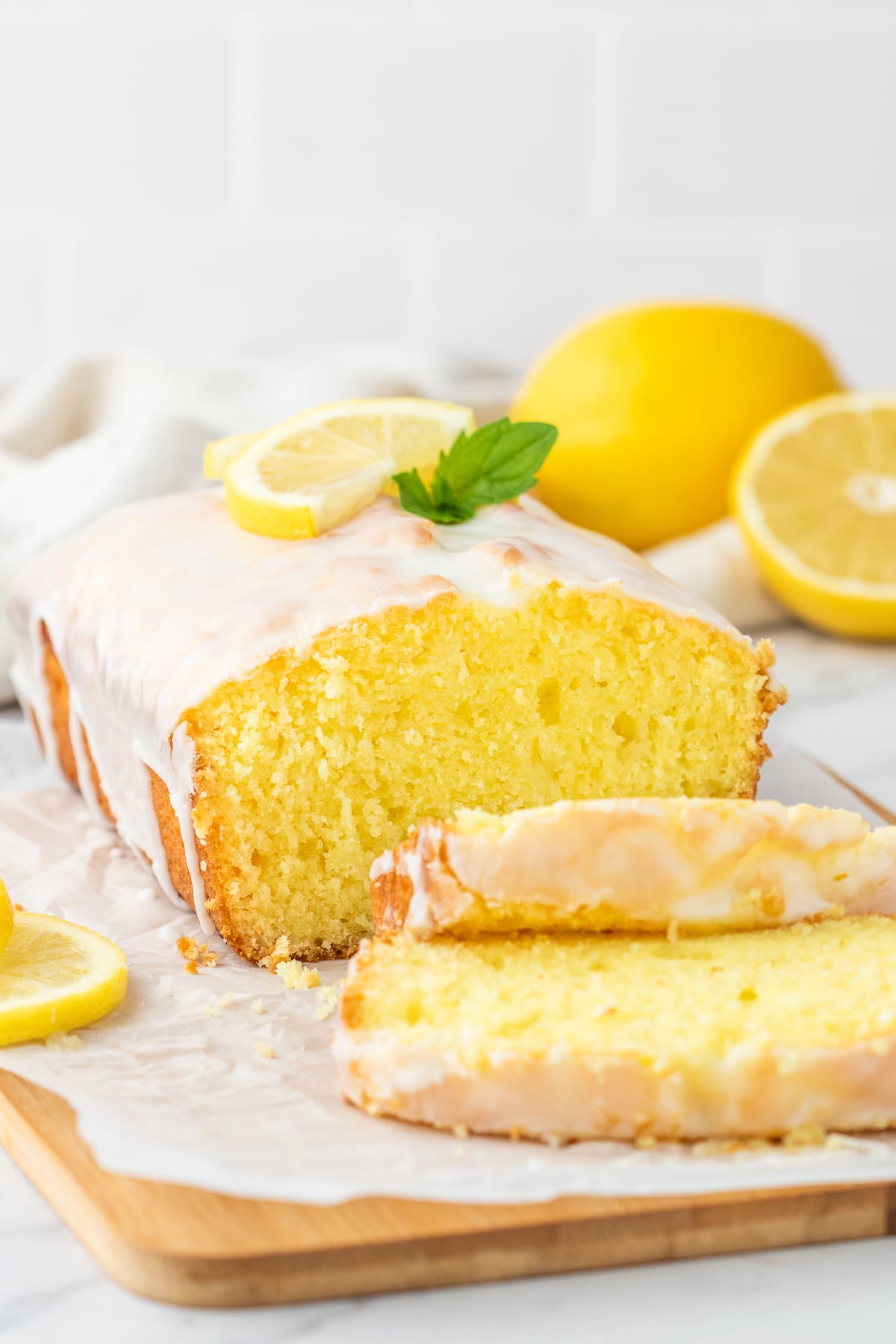 lemon pound cake sliced on wooden board