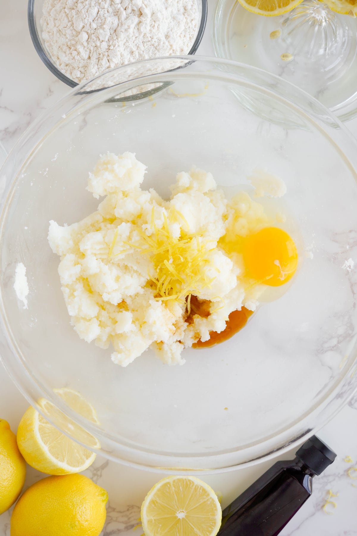eggs, vanilla extract and lemon zest in mixing bowl with creamed butter and sugar