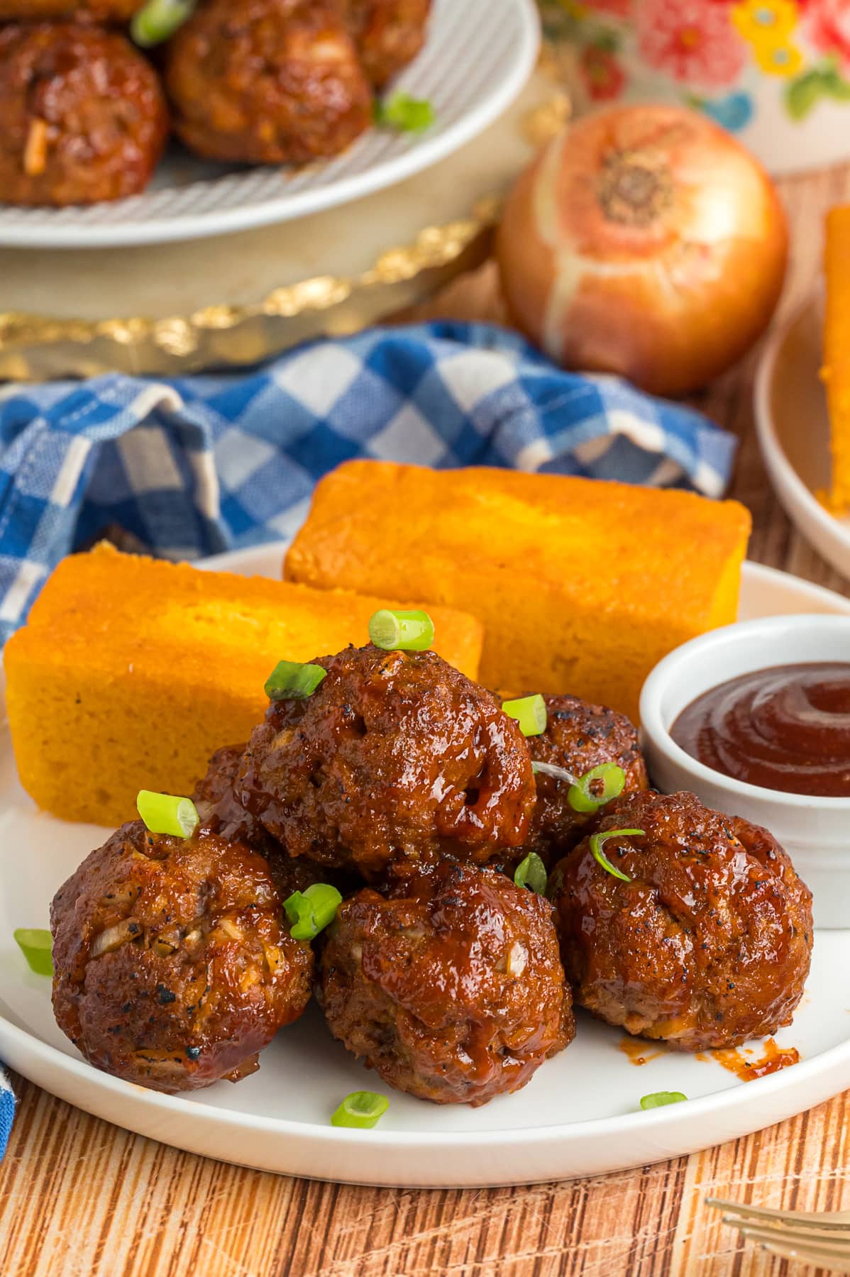 BBQ meatballs and cornbread on a plate