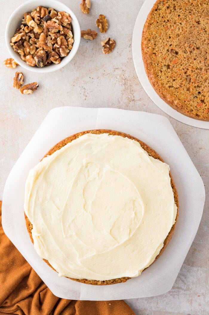 Cream cheese frosting on top of a carrot cake