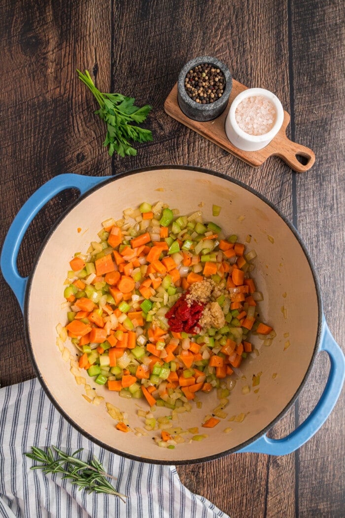 Chopped carrots, celery, and onion in a pot