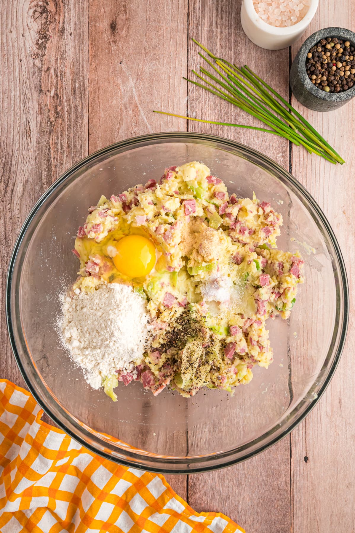 corned beef and potatoes in bowl with egg and seasonings