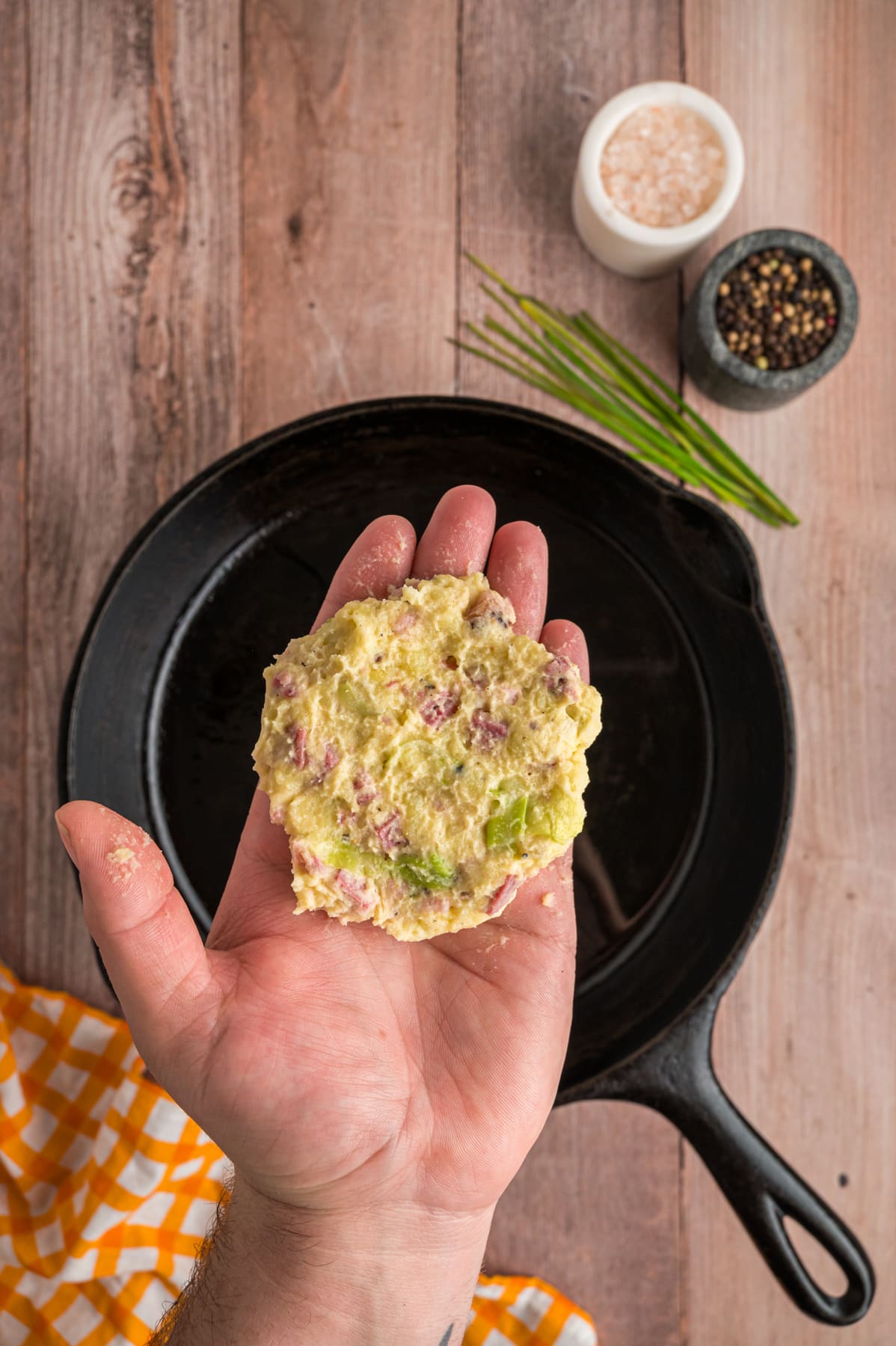 colcannon cake in hand ready to cook in pan