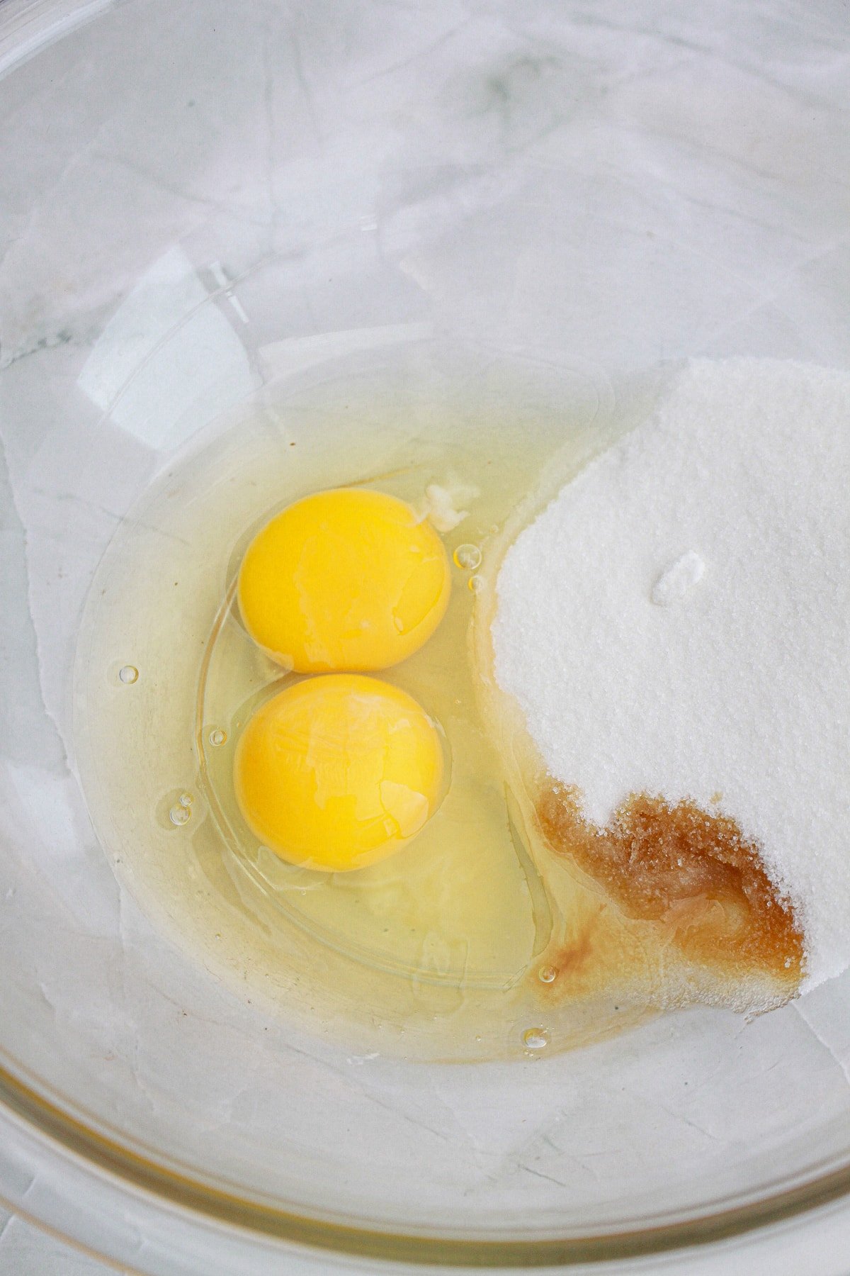 sugar, eggs and vanilla extract in mixing bowl