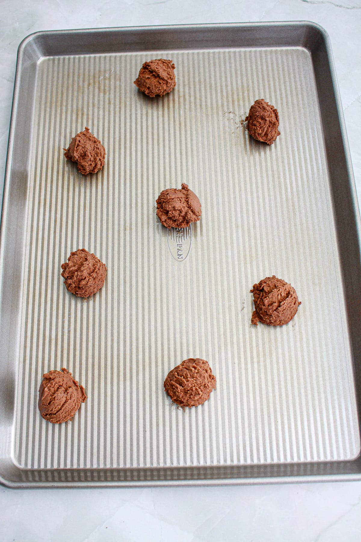 German chocolate cookies on baking sheet