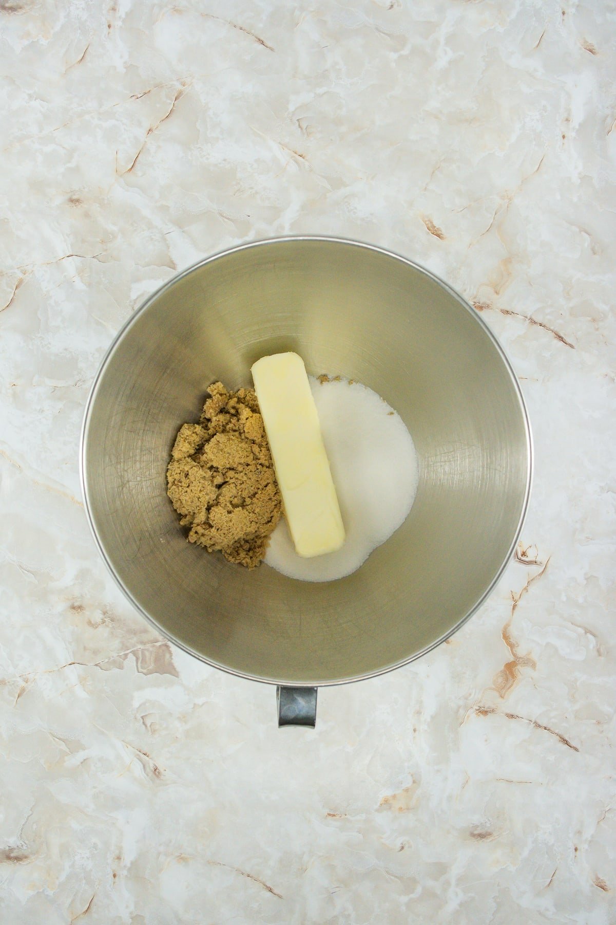 sugar and butter in mixing bowl