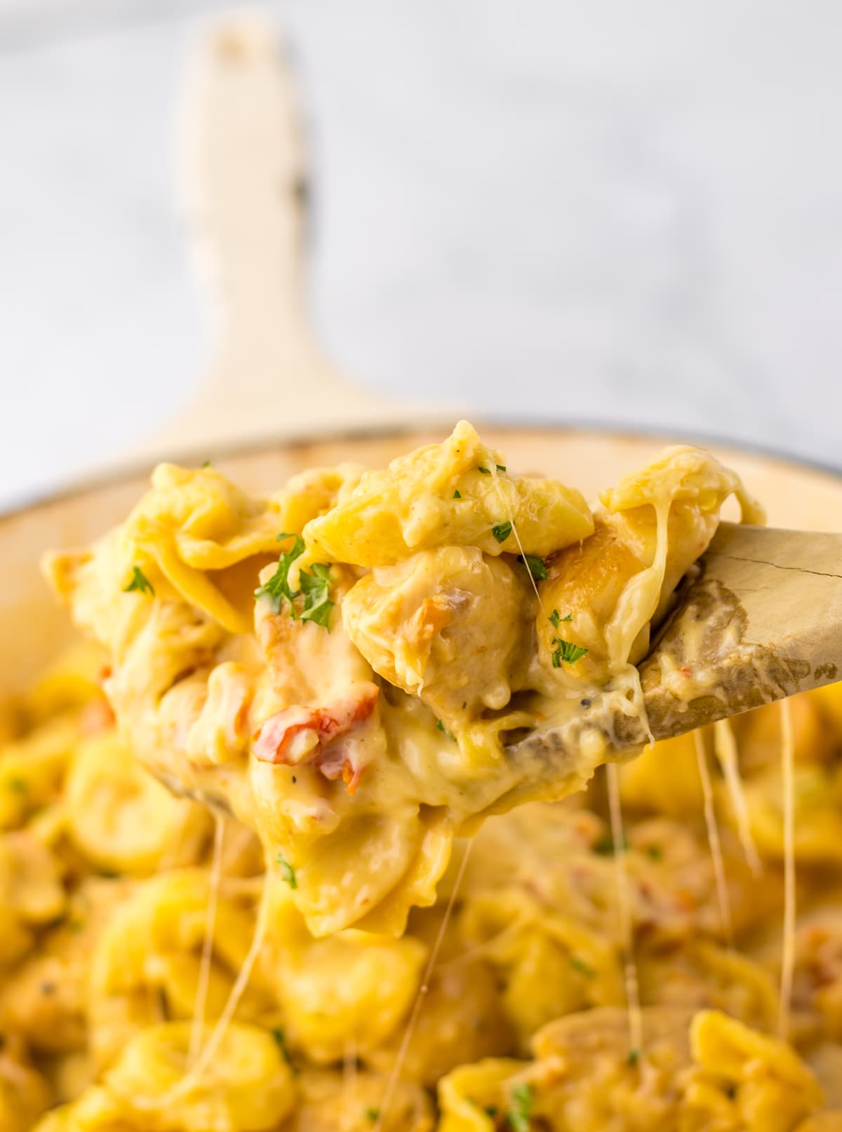 wooden spoon with Marry Me Chicken Tortellini