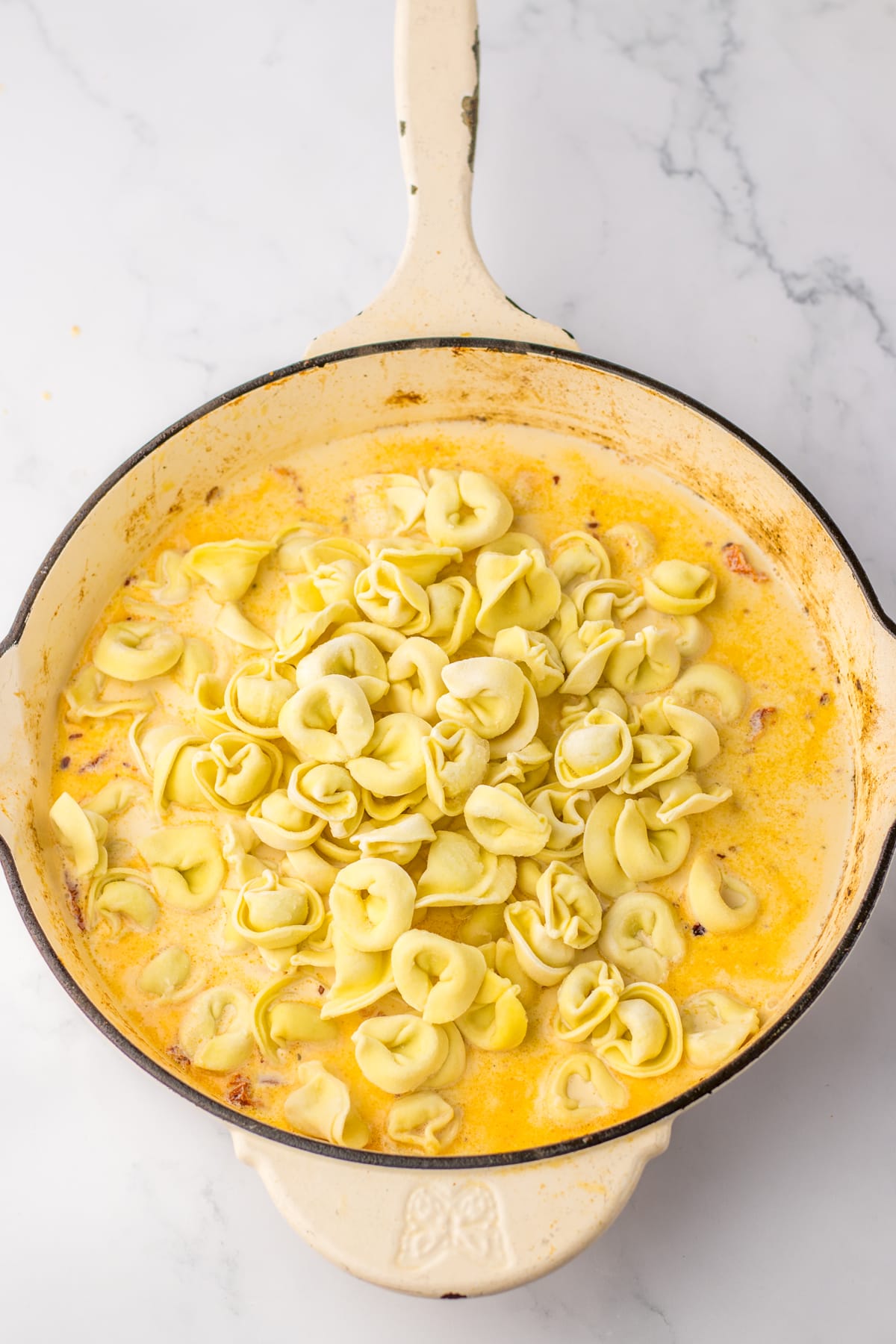 tortellini in skillet with sauce