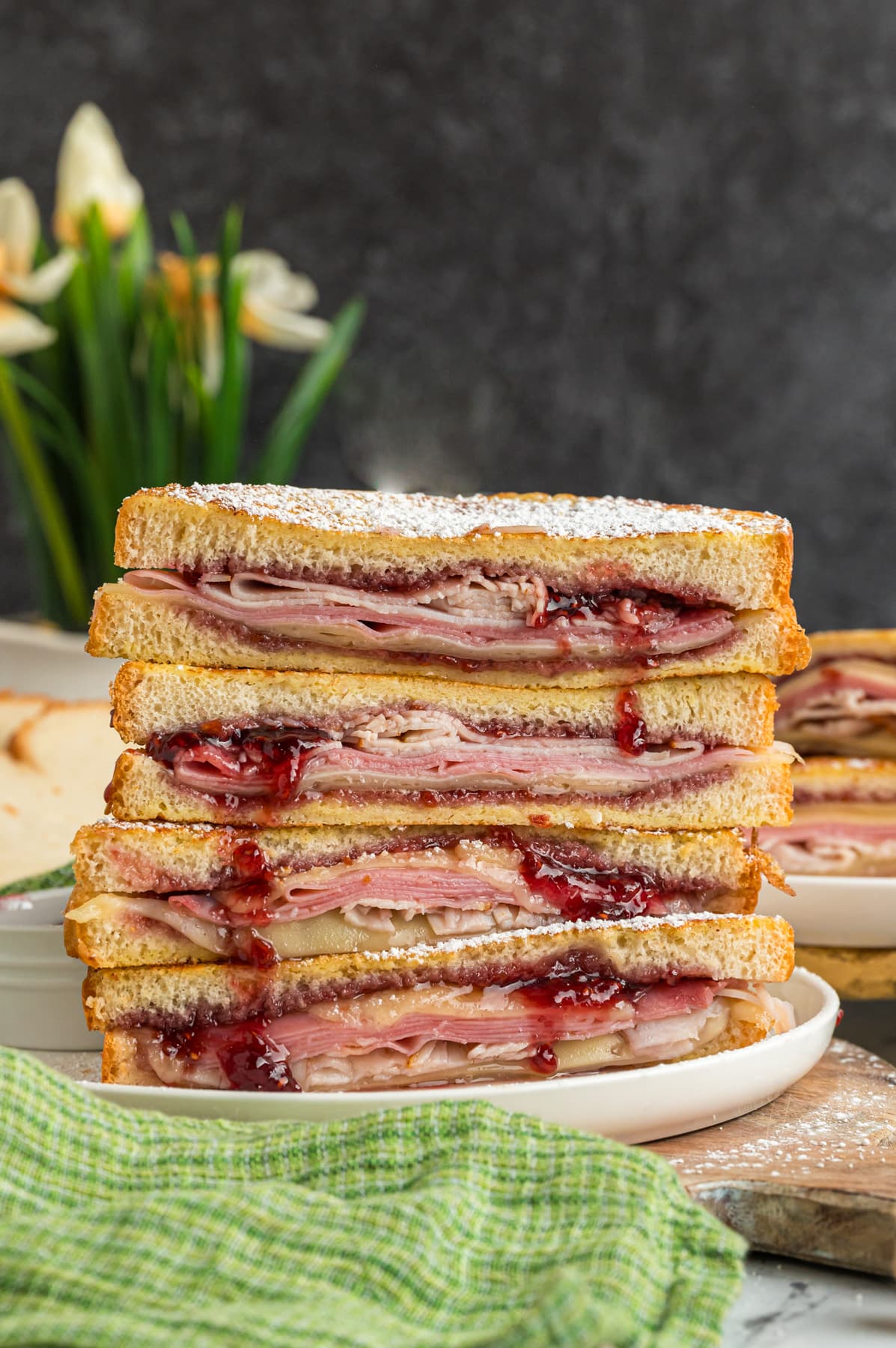 Four halves of Monte Cristo sandwiches stacked on each other