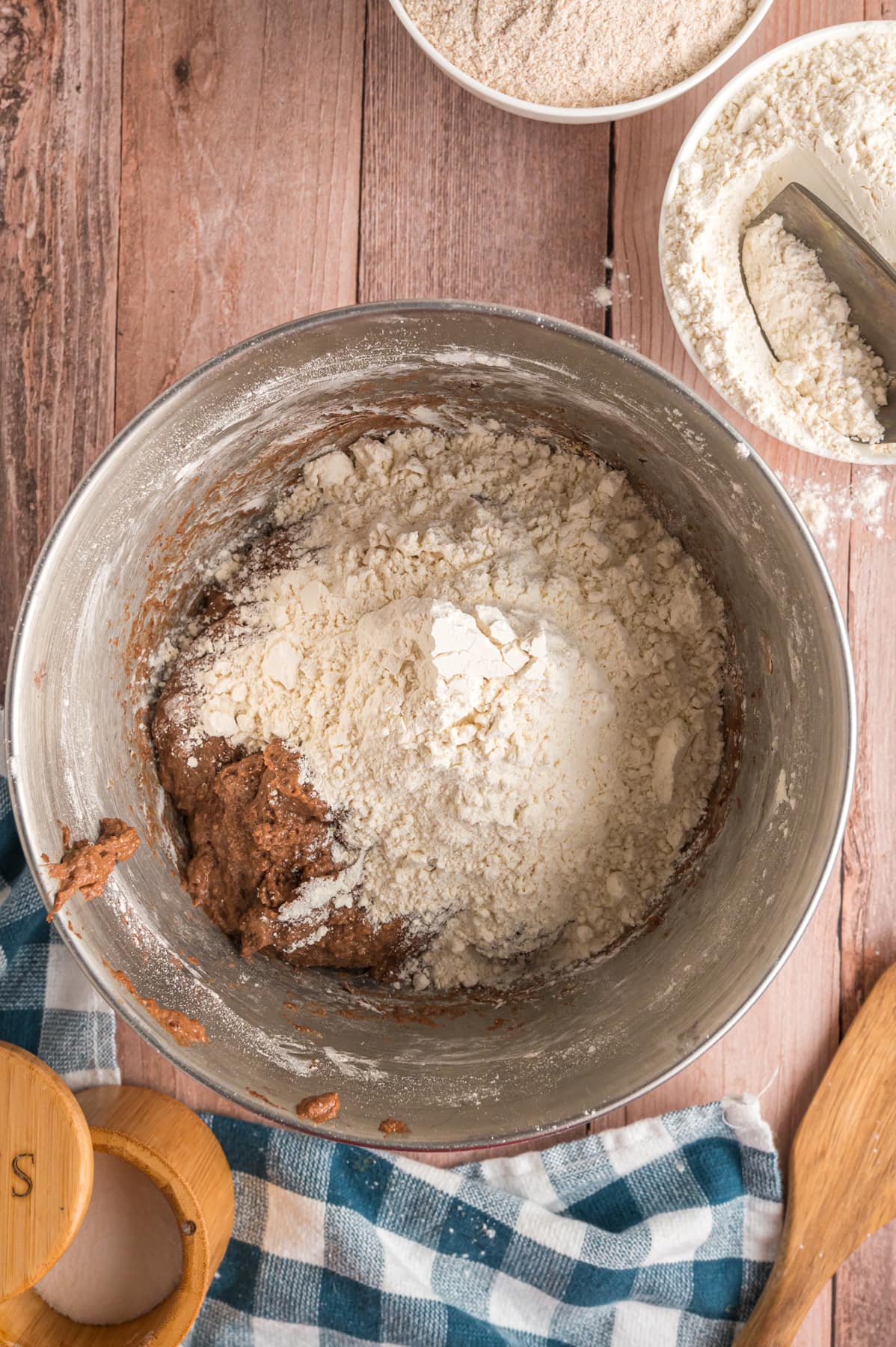 flour in mixing bowl with bread dough