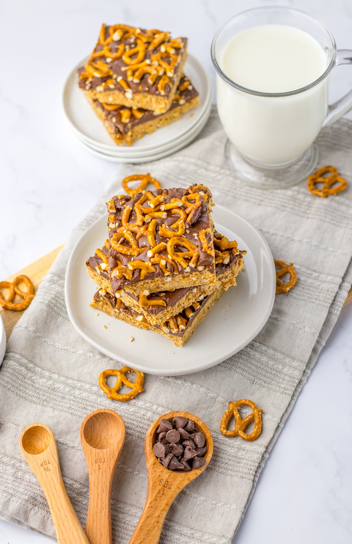 Peanut Butter Pretzel Bars on plate with glass of milk