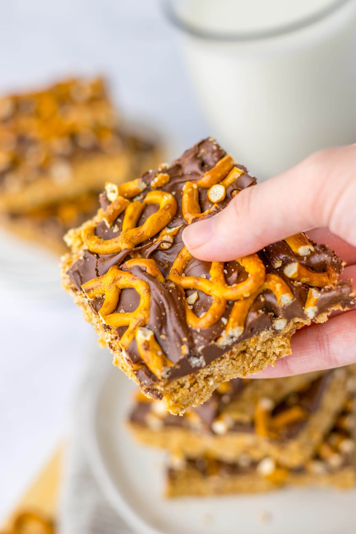 hand holding Peanut Butter Pretzel Bars