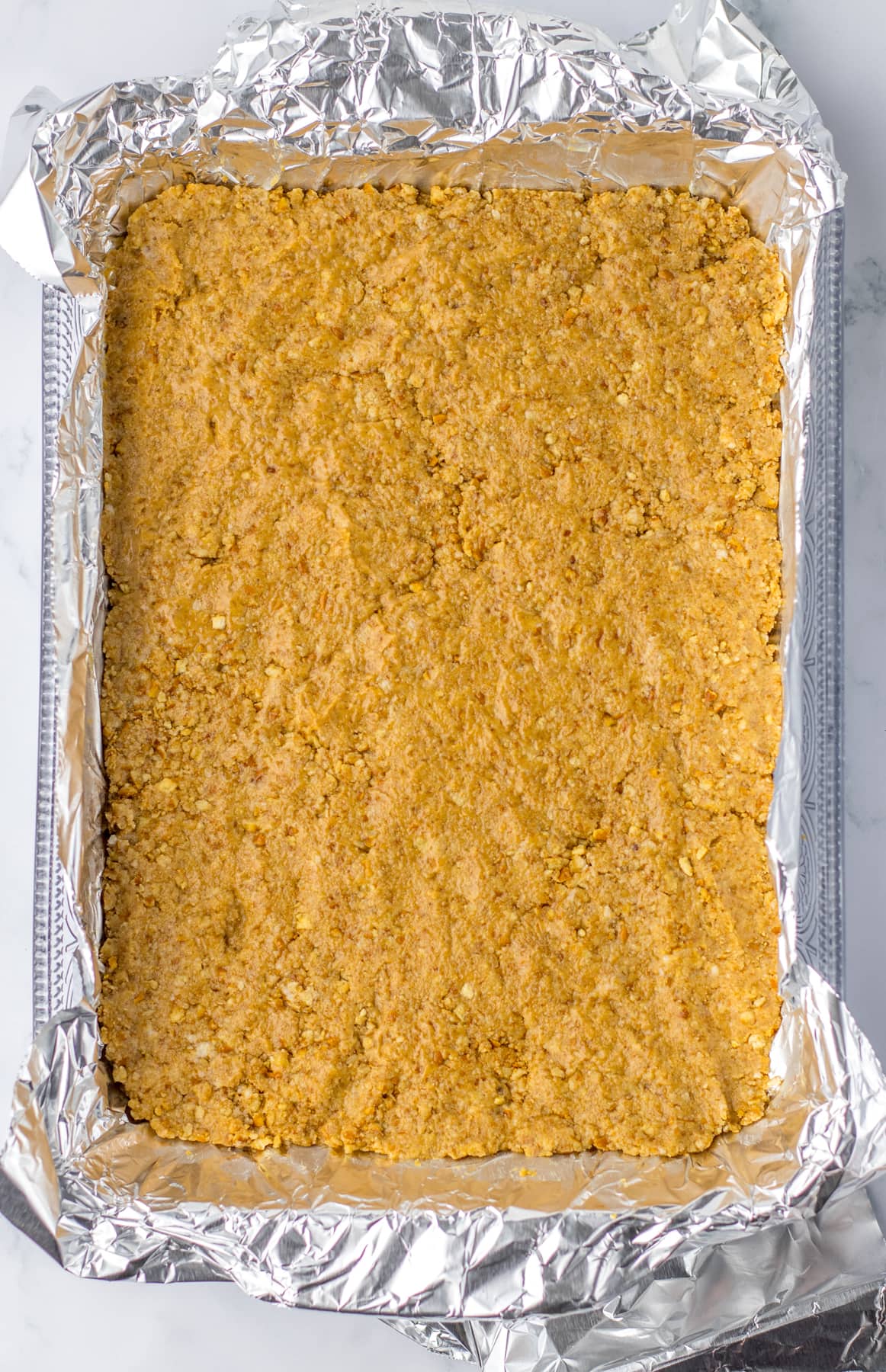 crust for Peanut Butter Pretzel Bars in pan