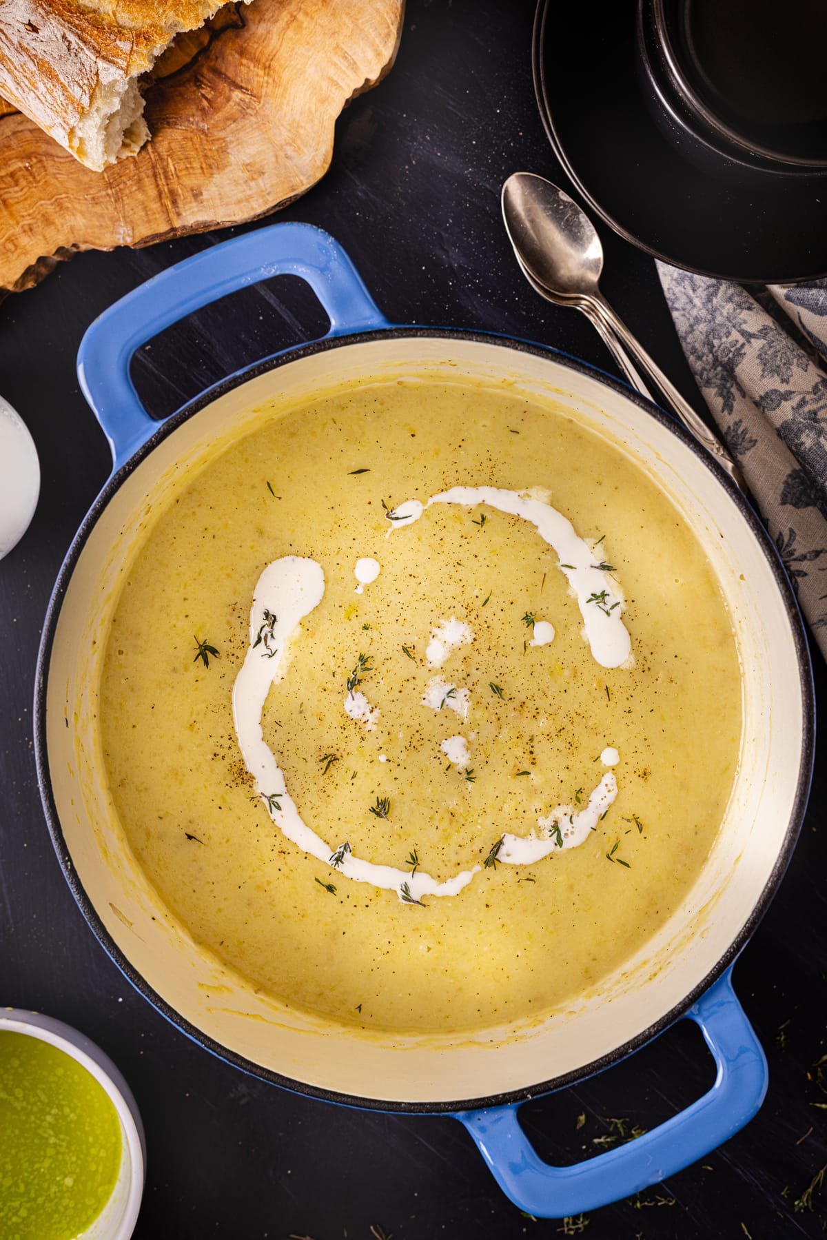 Potato and leek soup with sour cream in a pot