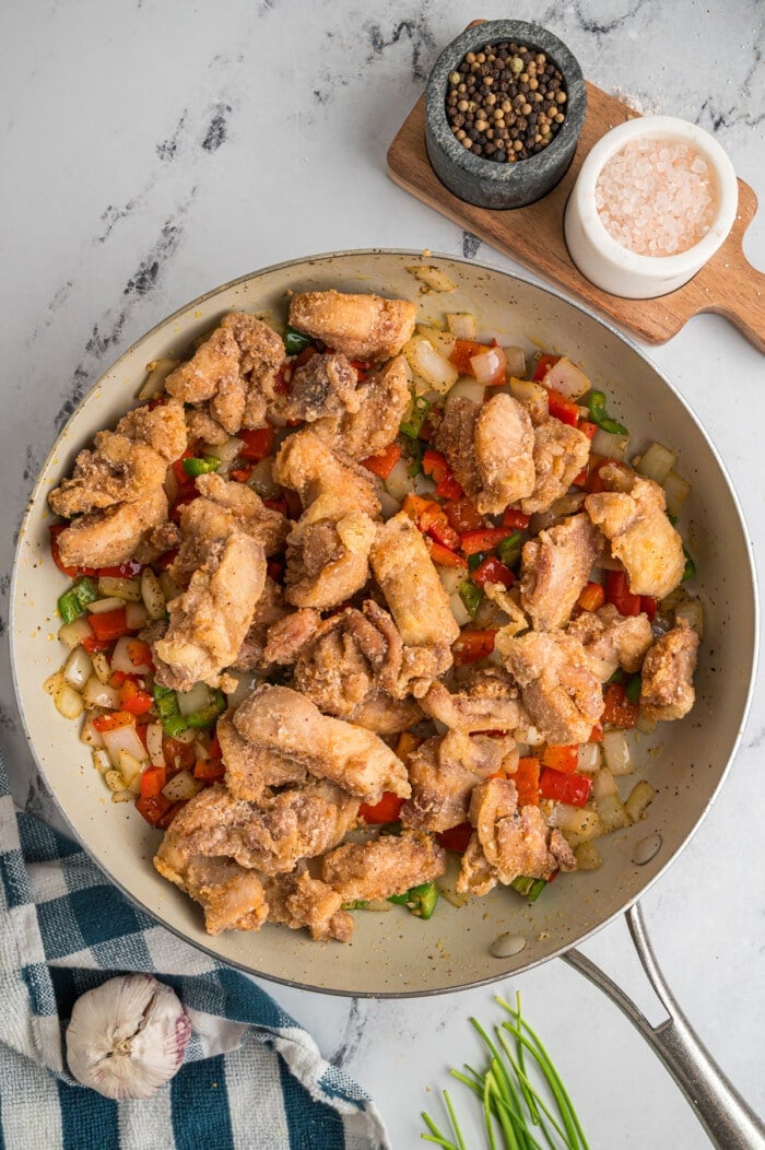 Salt and pepper chicken in a pan