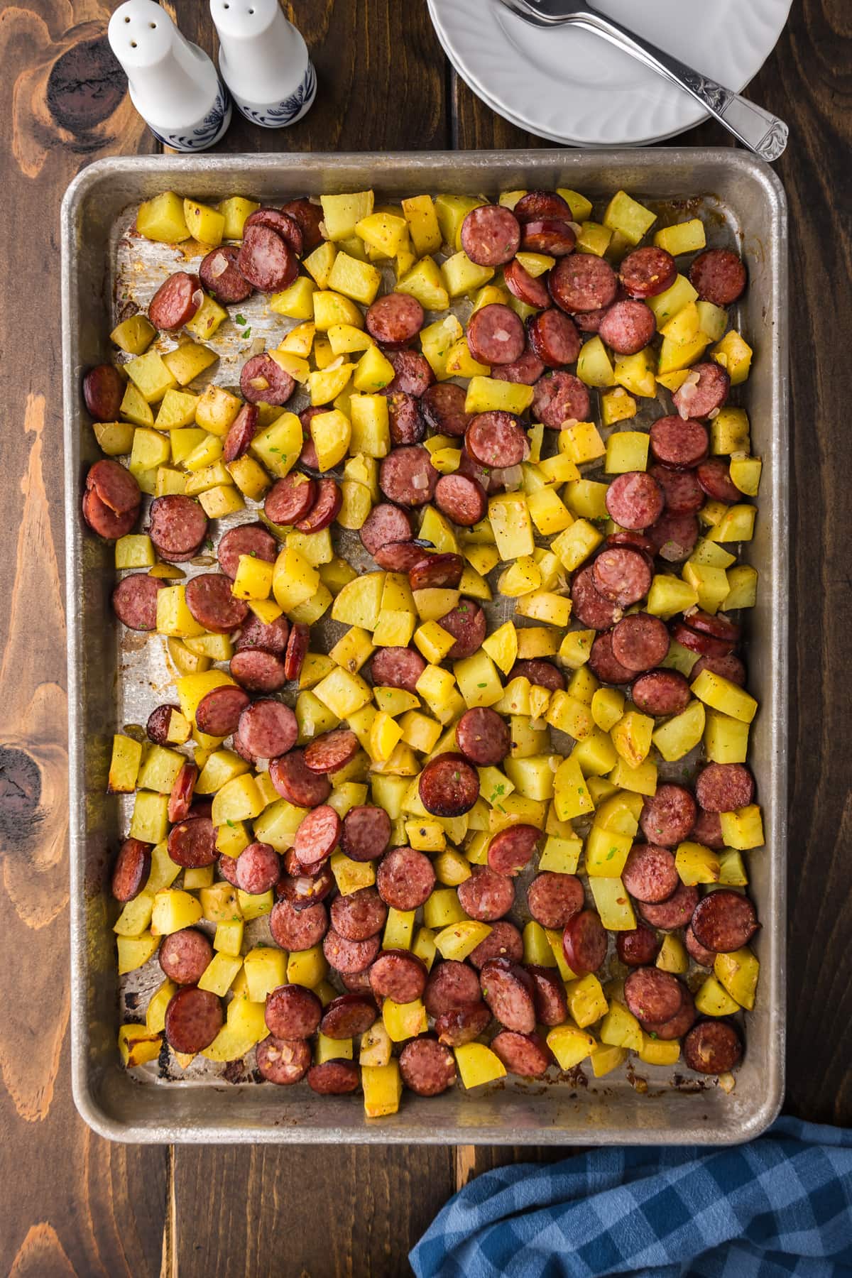 sausage and potatoes cooked on sheet pan