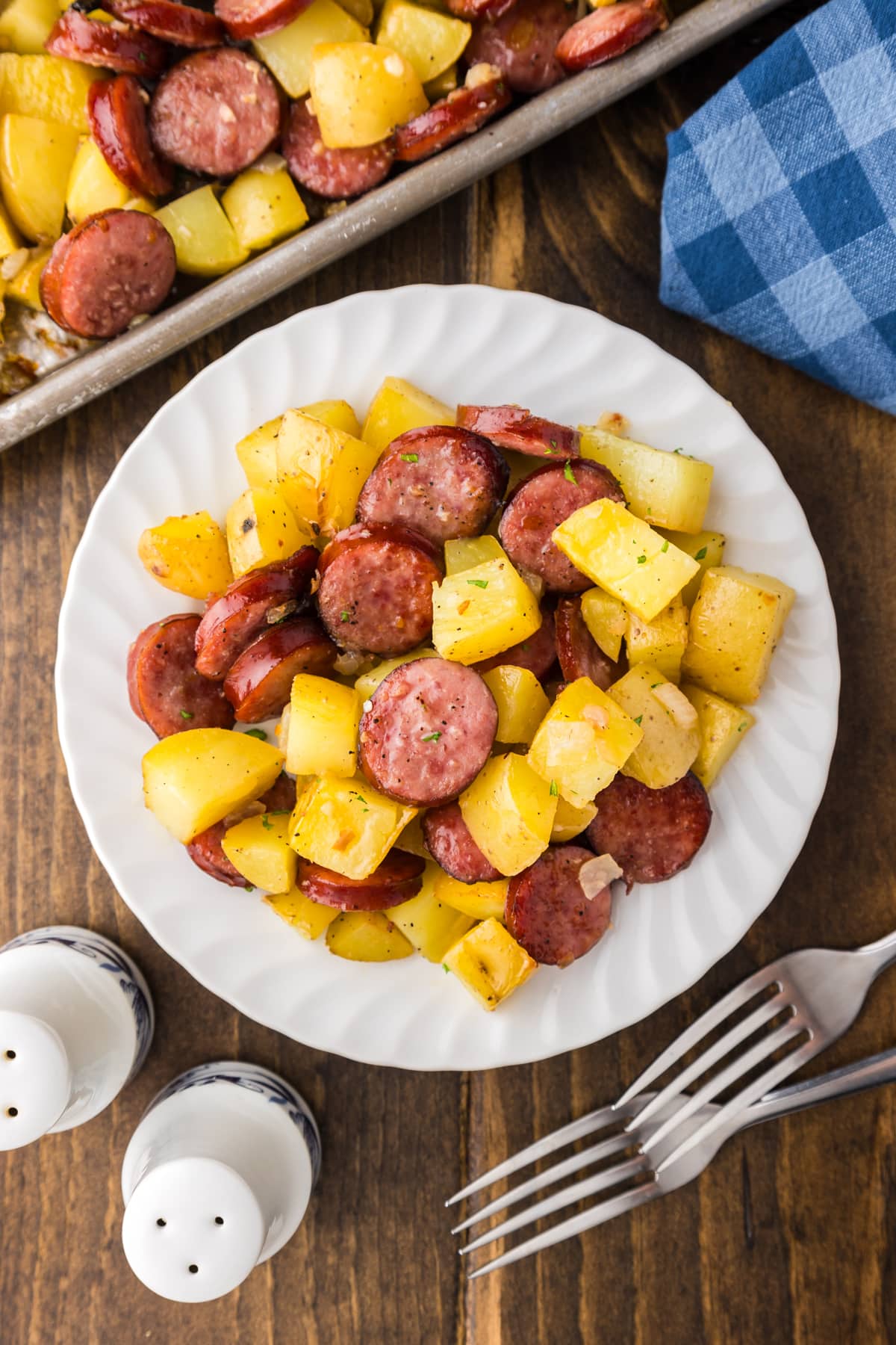 sausage and potatoes on white plate