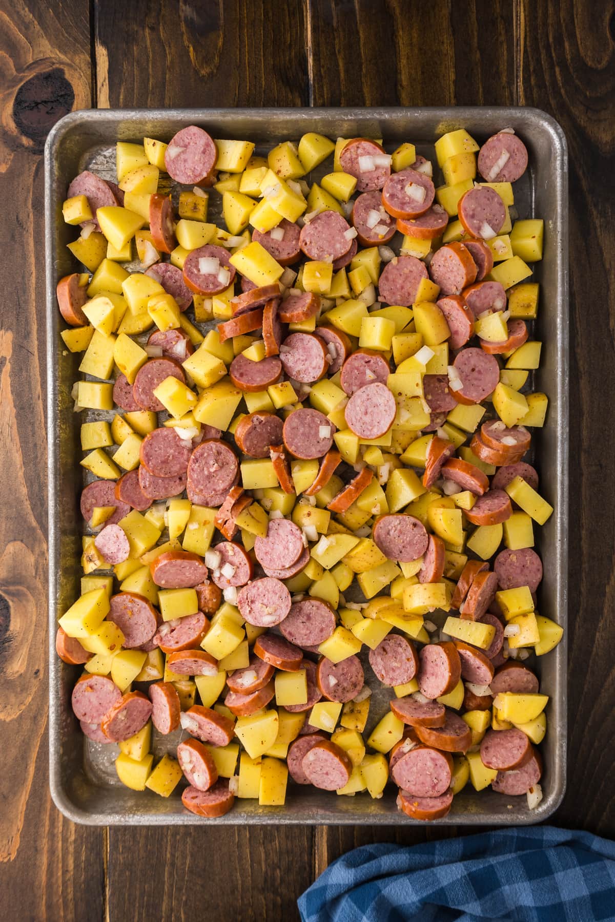 sausage and potatoes on sheet baking pan