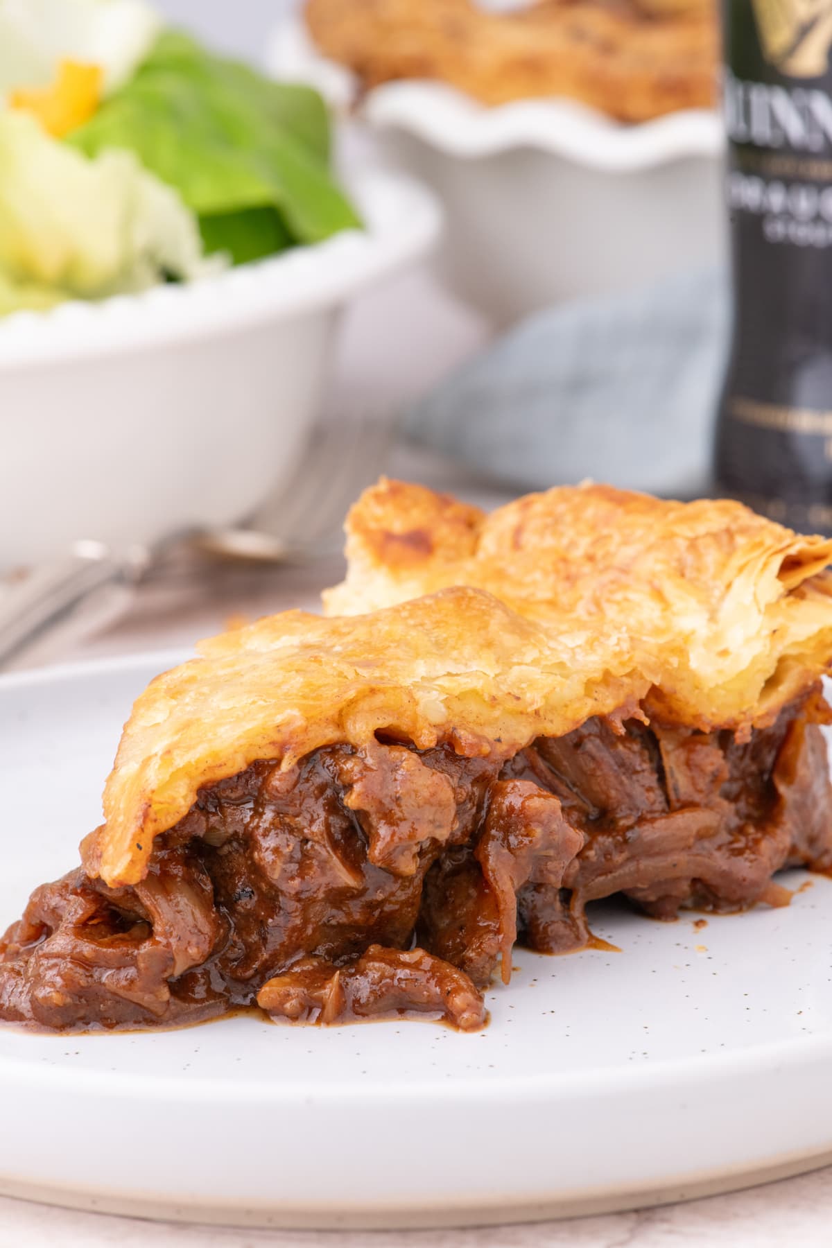 slice of Steak and Ale Pie on white plate