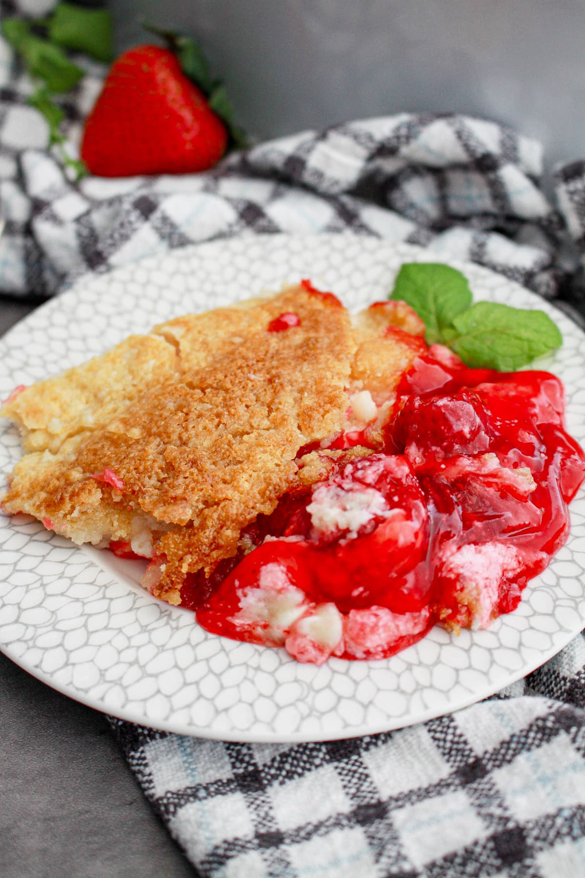 plate with serving of strawberry dump cake