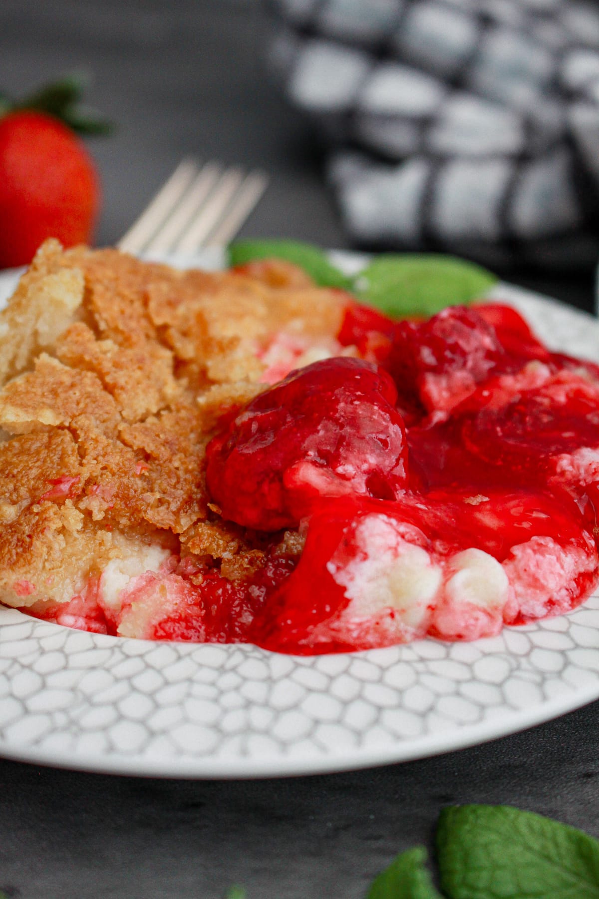 serving of strawberry dump cake on plate