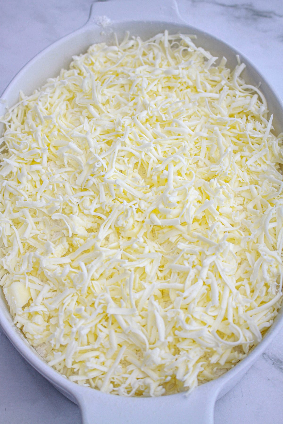 grated butter on top of cake mix for strawberry dump cake