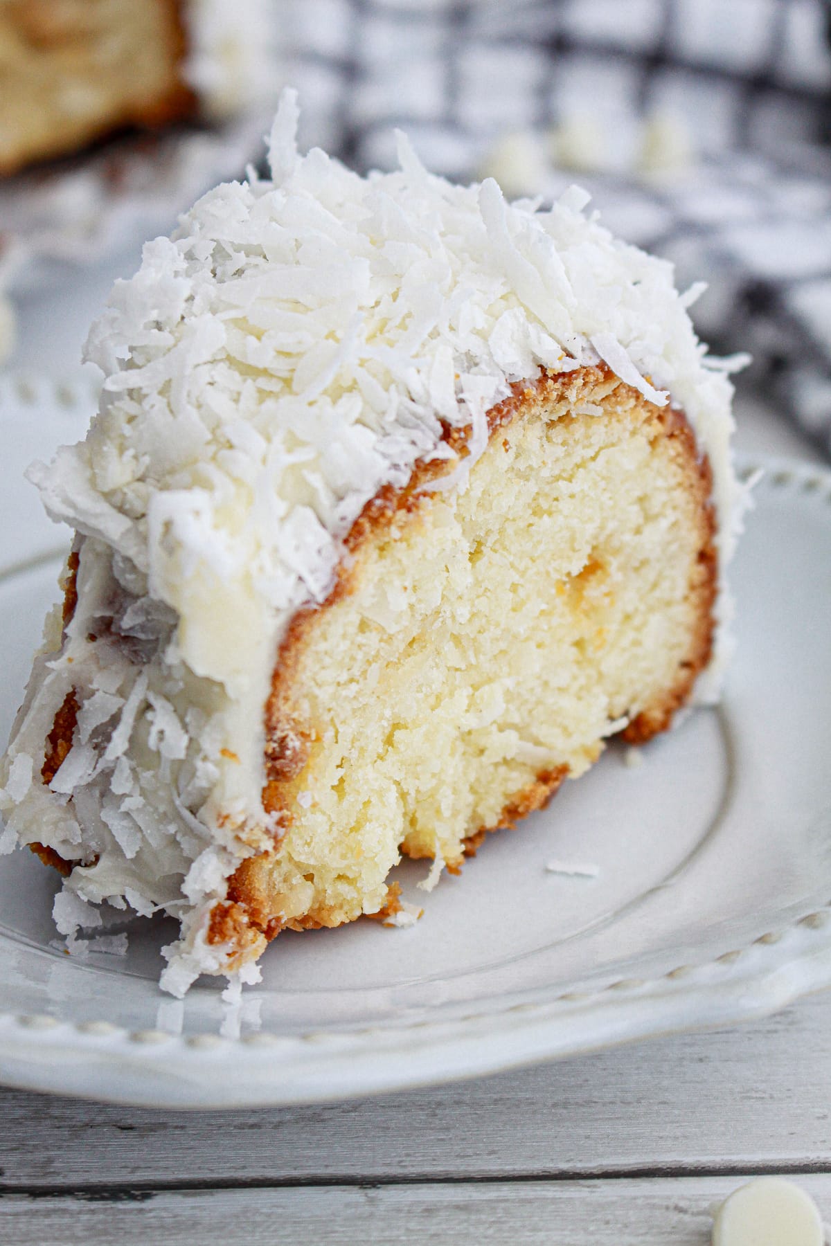 piece of White Chocolate Coconut Bundt Cake on white plate