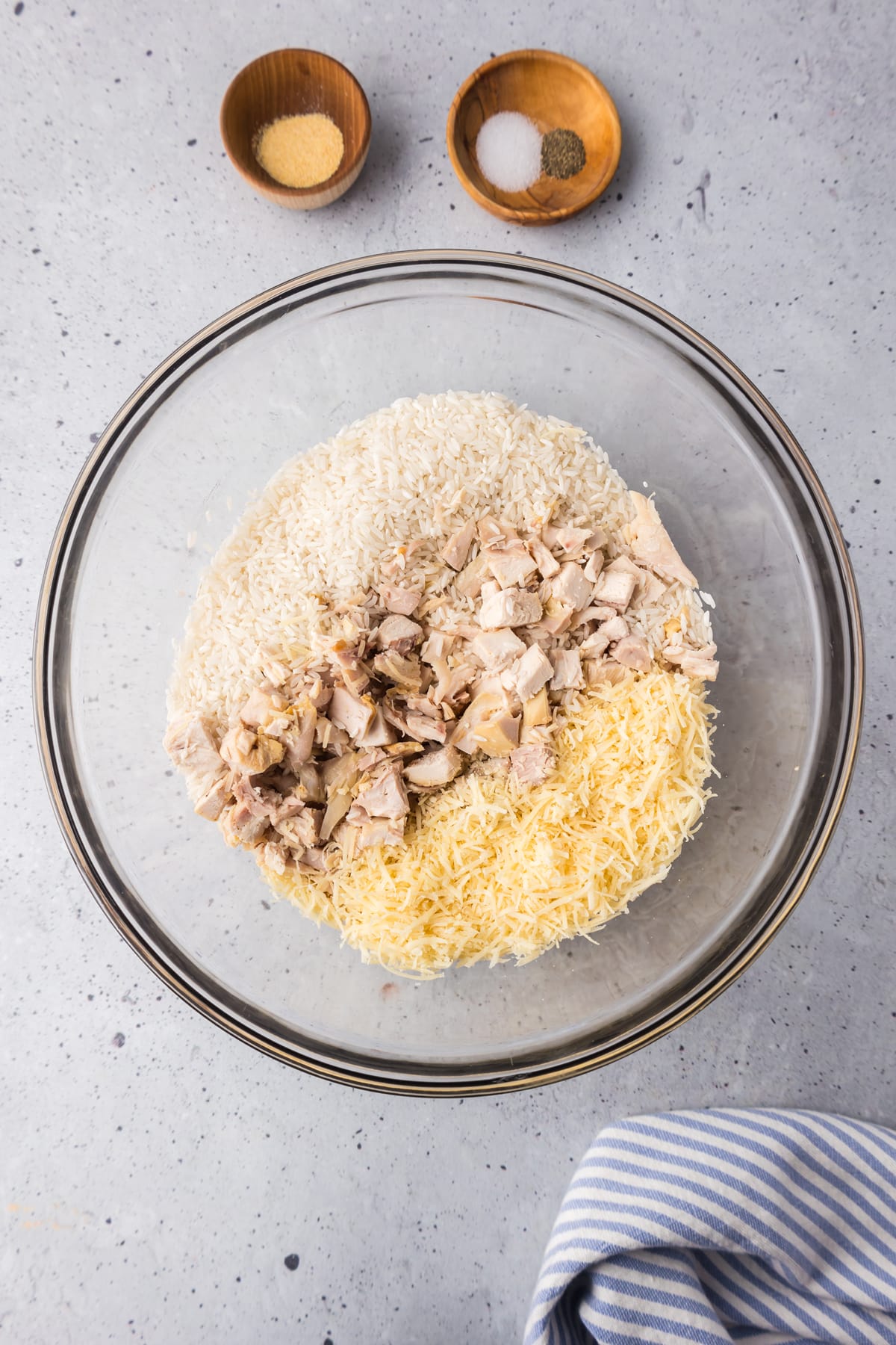 chicken in bowl with rice and parmesan cheese