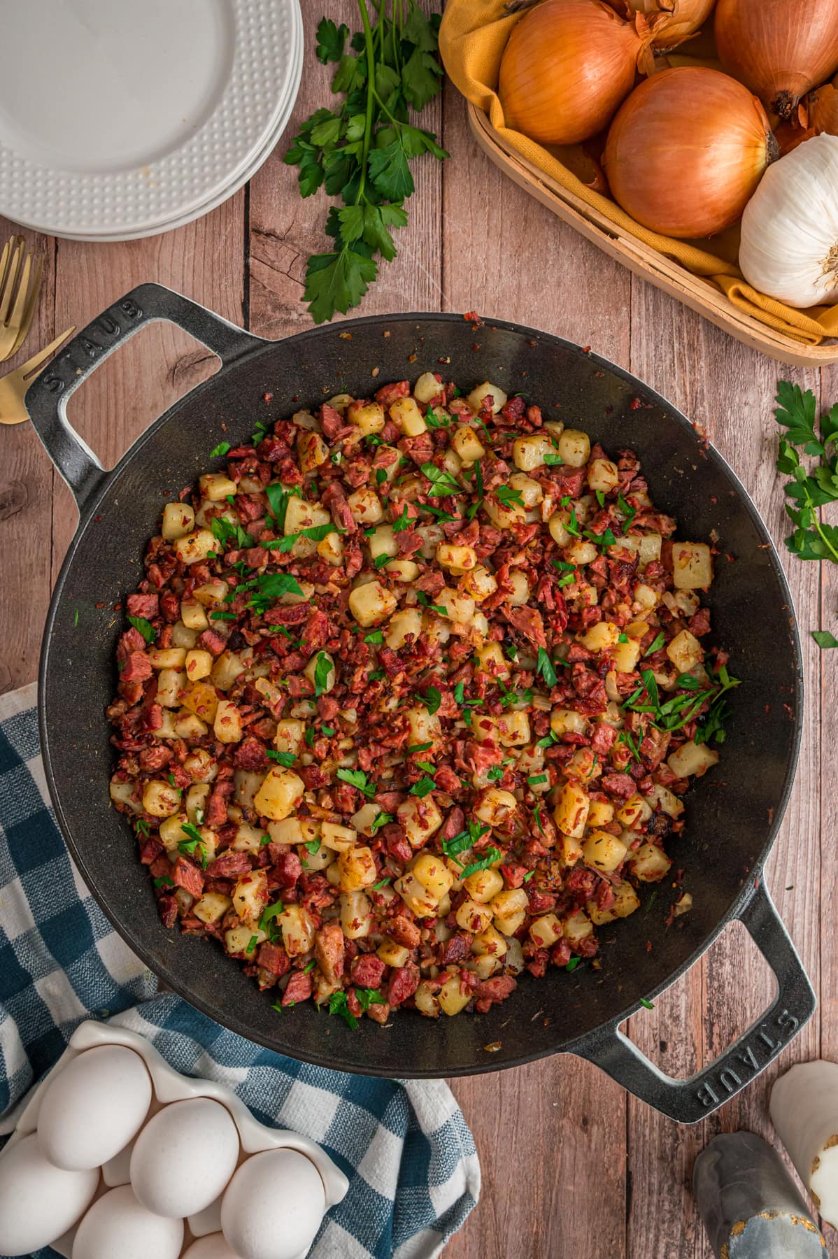 Cooked corned beef hash garnished with green onions.