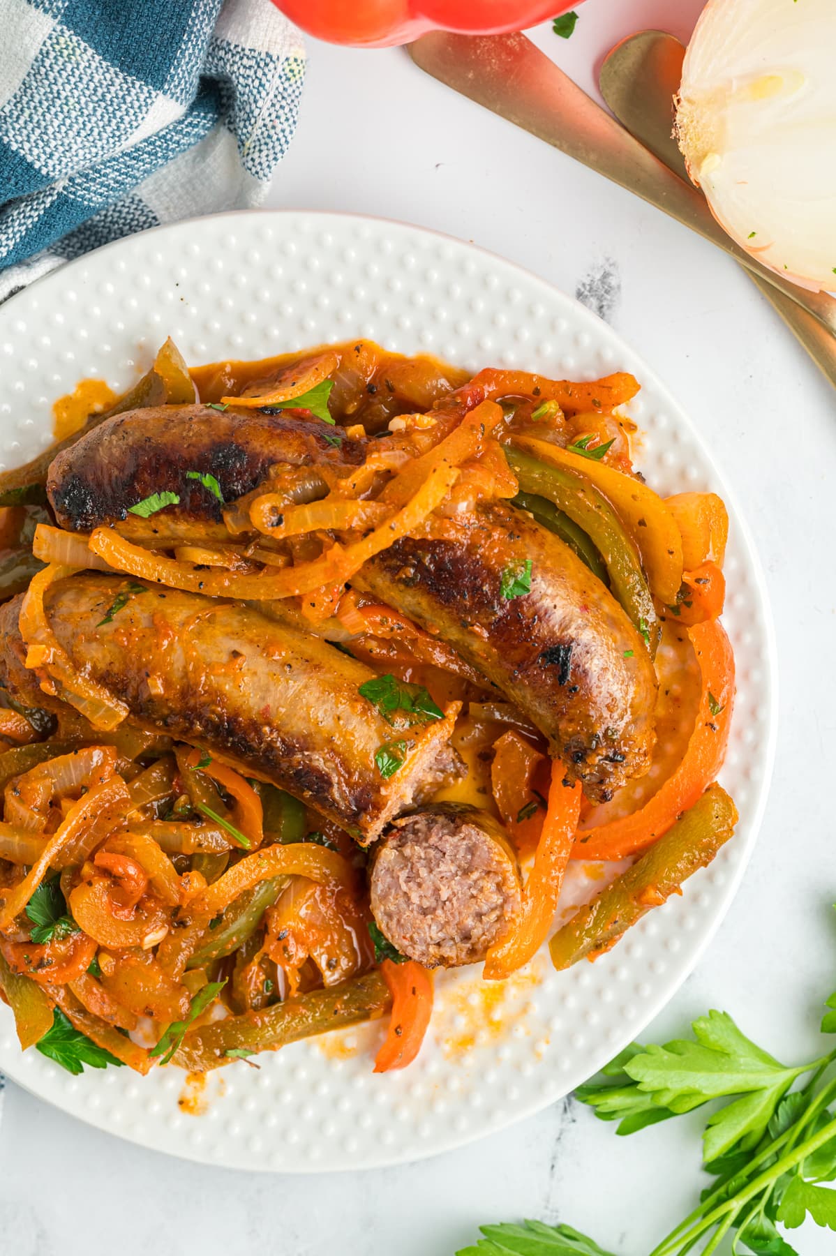 Overhead view of a plate of Italian sausage and peppers