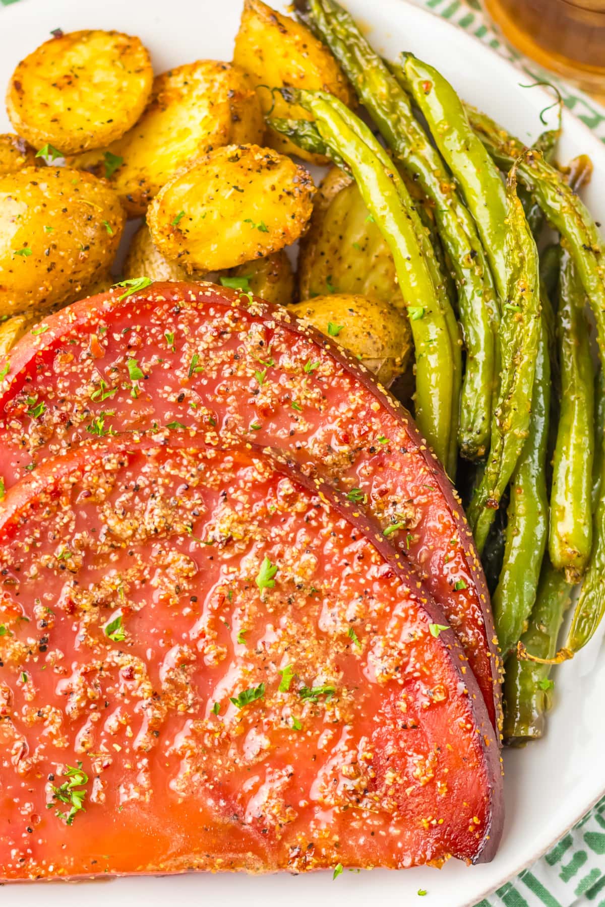 Ham Steak on a plate with potatoes and asparagus
