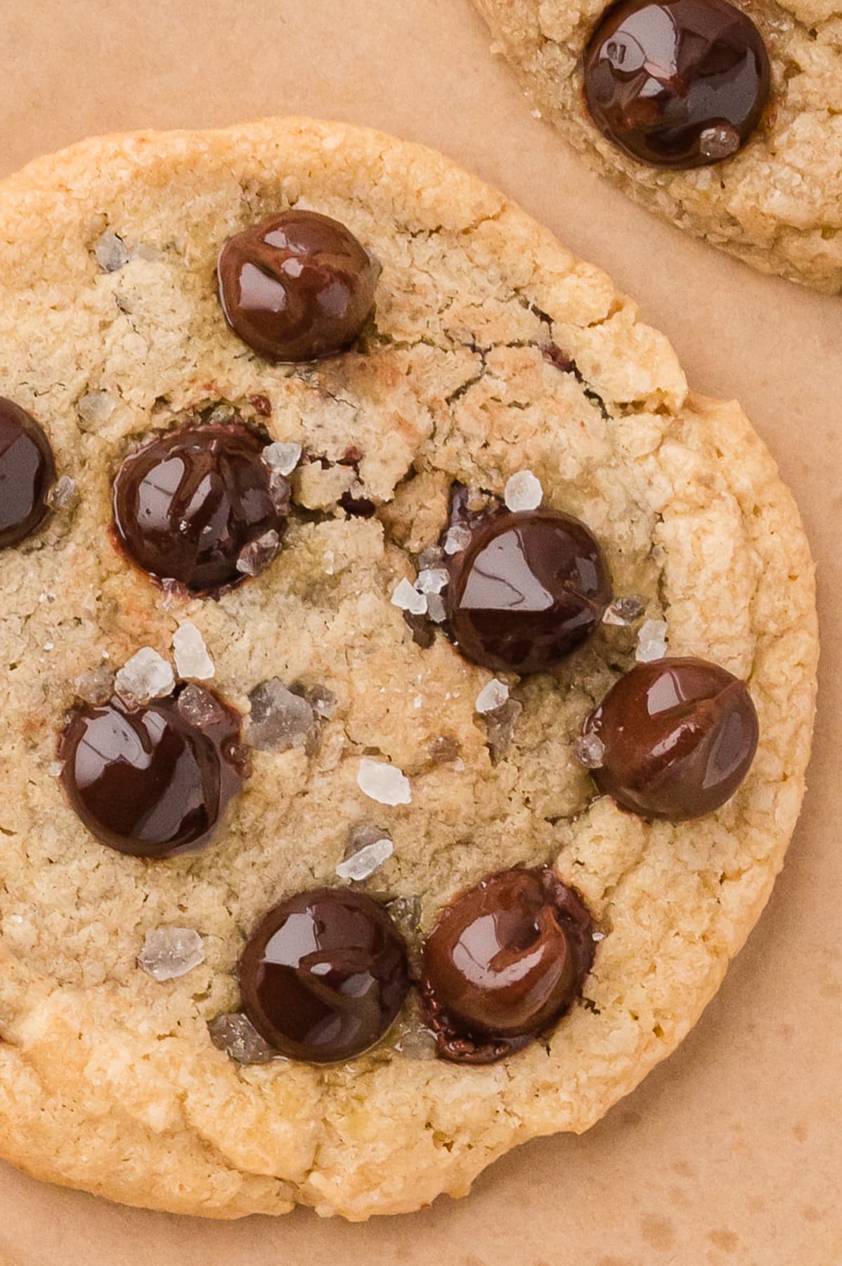 Close up of a brown butter chocolate chip cookies with sea salt flakes