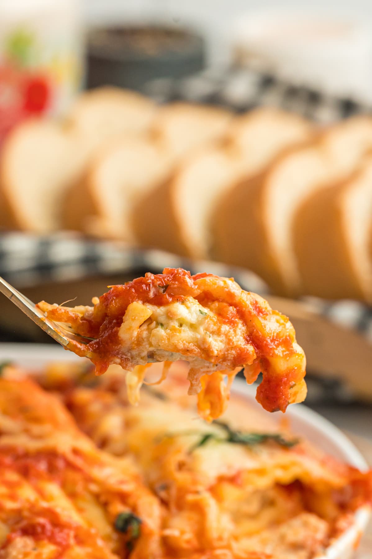 fork with cheesy Manicotti