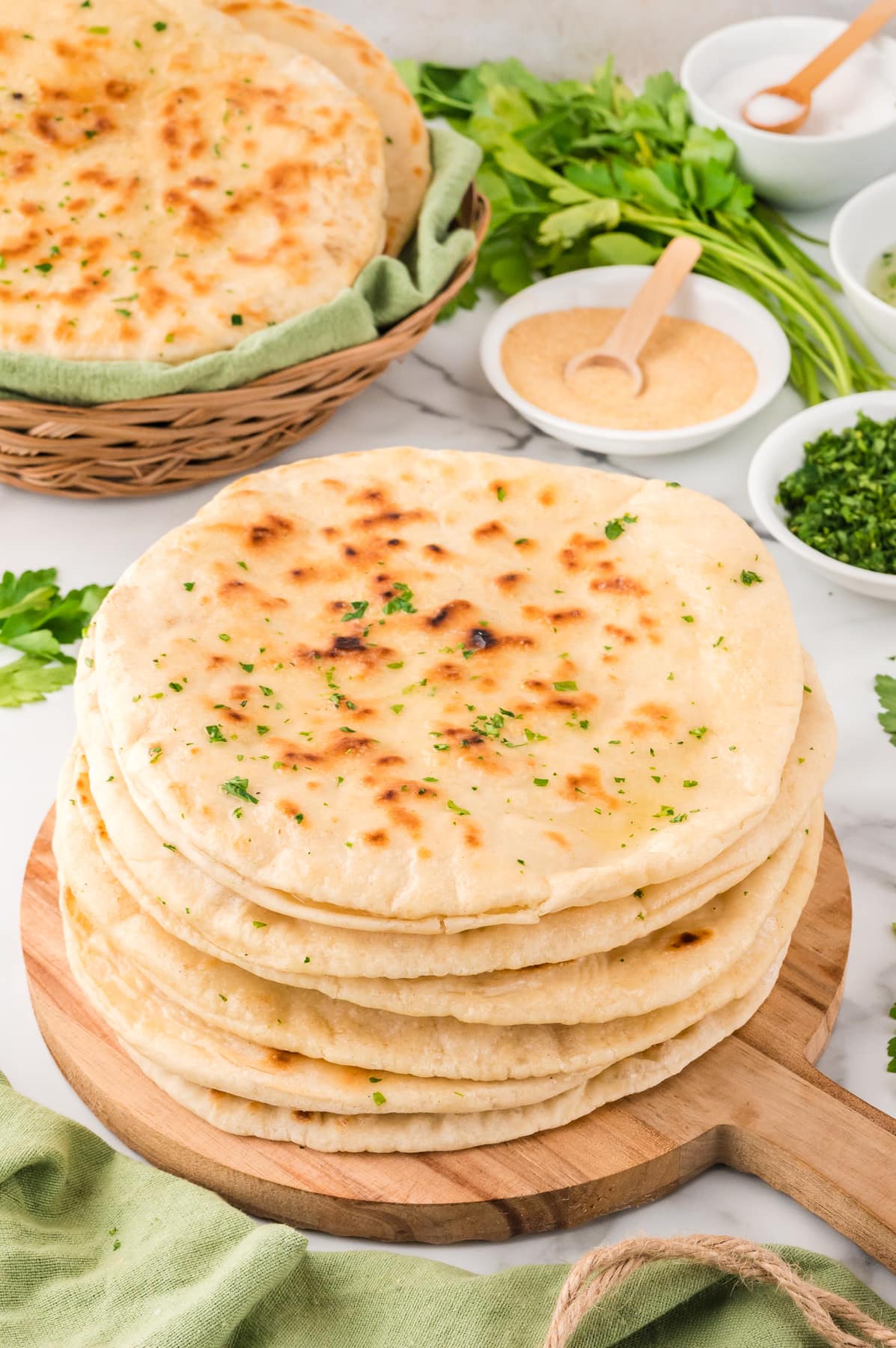 stack of Naan Bread Recipe on wooden board