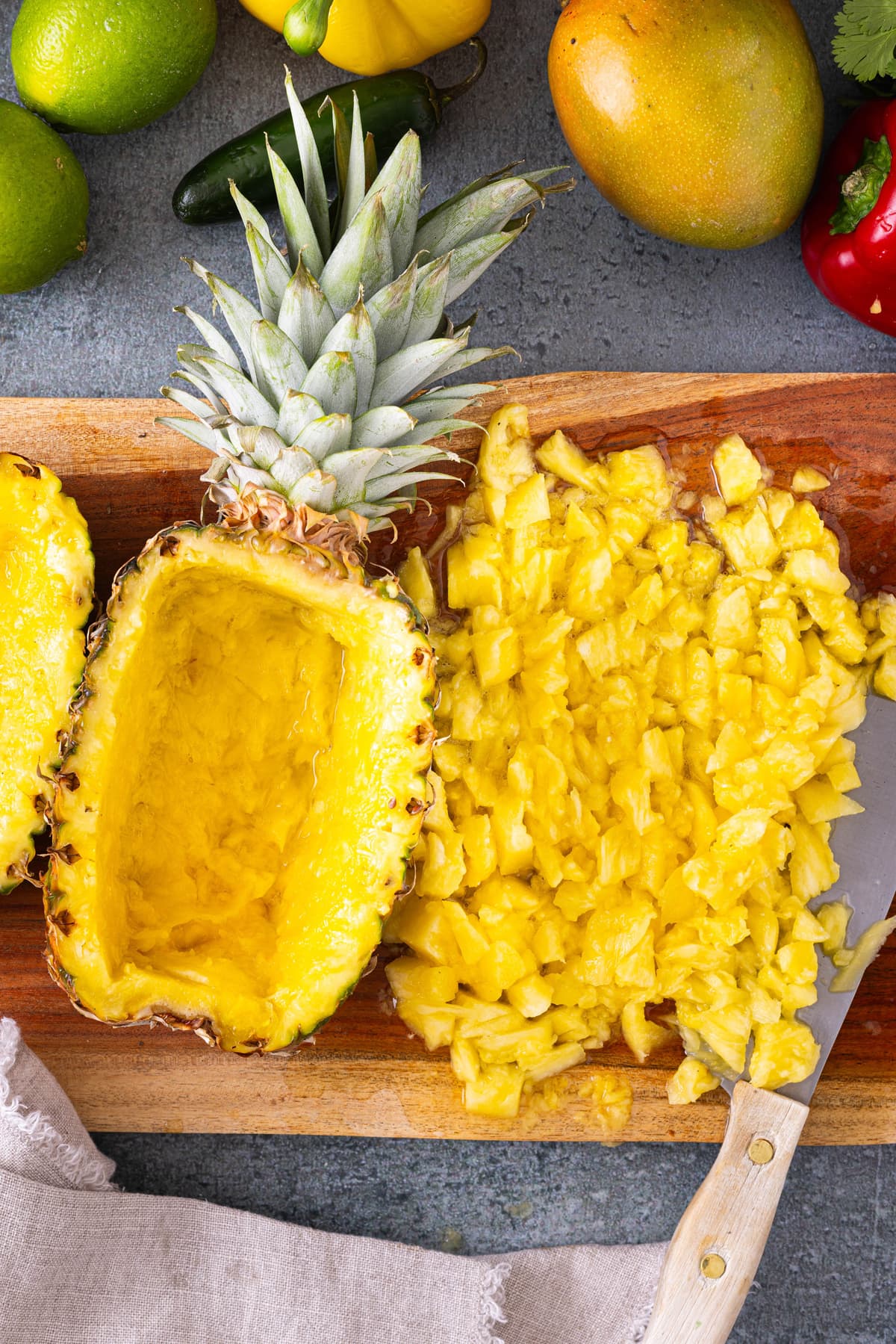 pieces of pineapple on cutting board for Pineapple Salsa