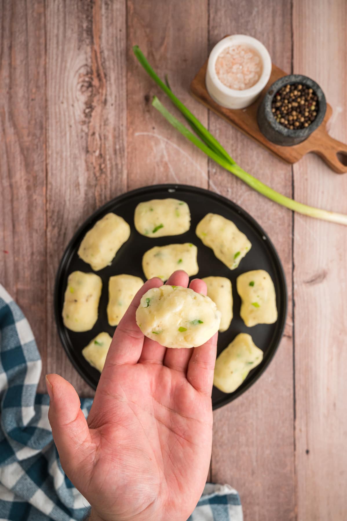 Potato Croquettes formed and held in hand