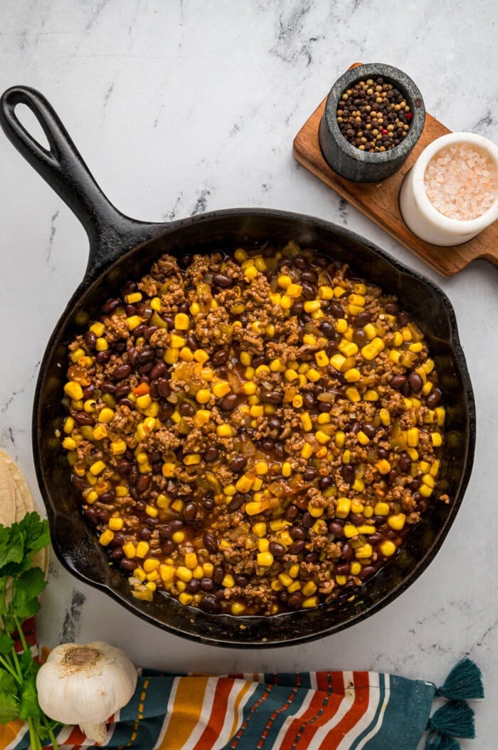 Ground beef, black beans, and corn in a skillet