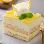 Closeup view of a serving of Lemon Tiramisu on a white plate.