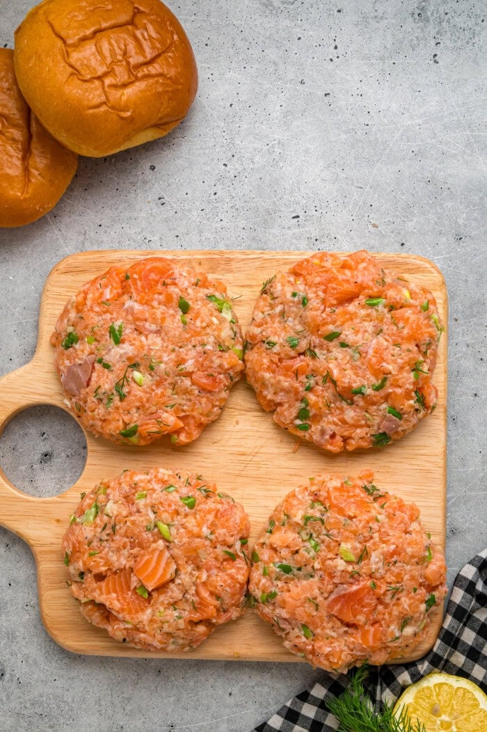 Salmon patties on a cutting board