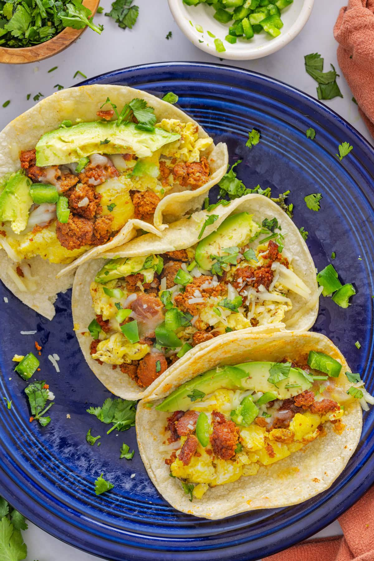 These homemade Breakfast Tacos are savory, cheesy, and everything you could want in a corn tortilla! Serve them for any meal or meal prep so you can enjoy them all week. Breakfast Tacos with Chorizo