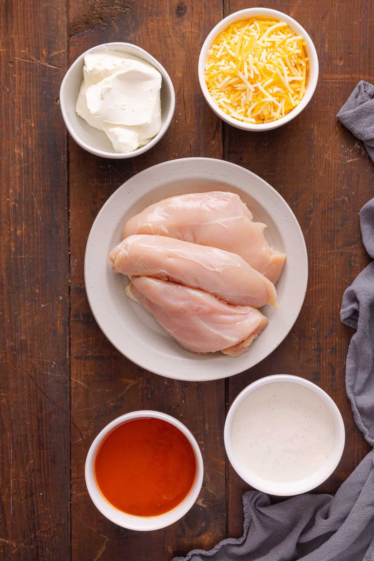Overhead view of ingredients needed to make buffalo chicken dip