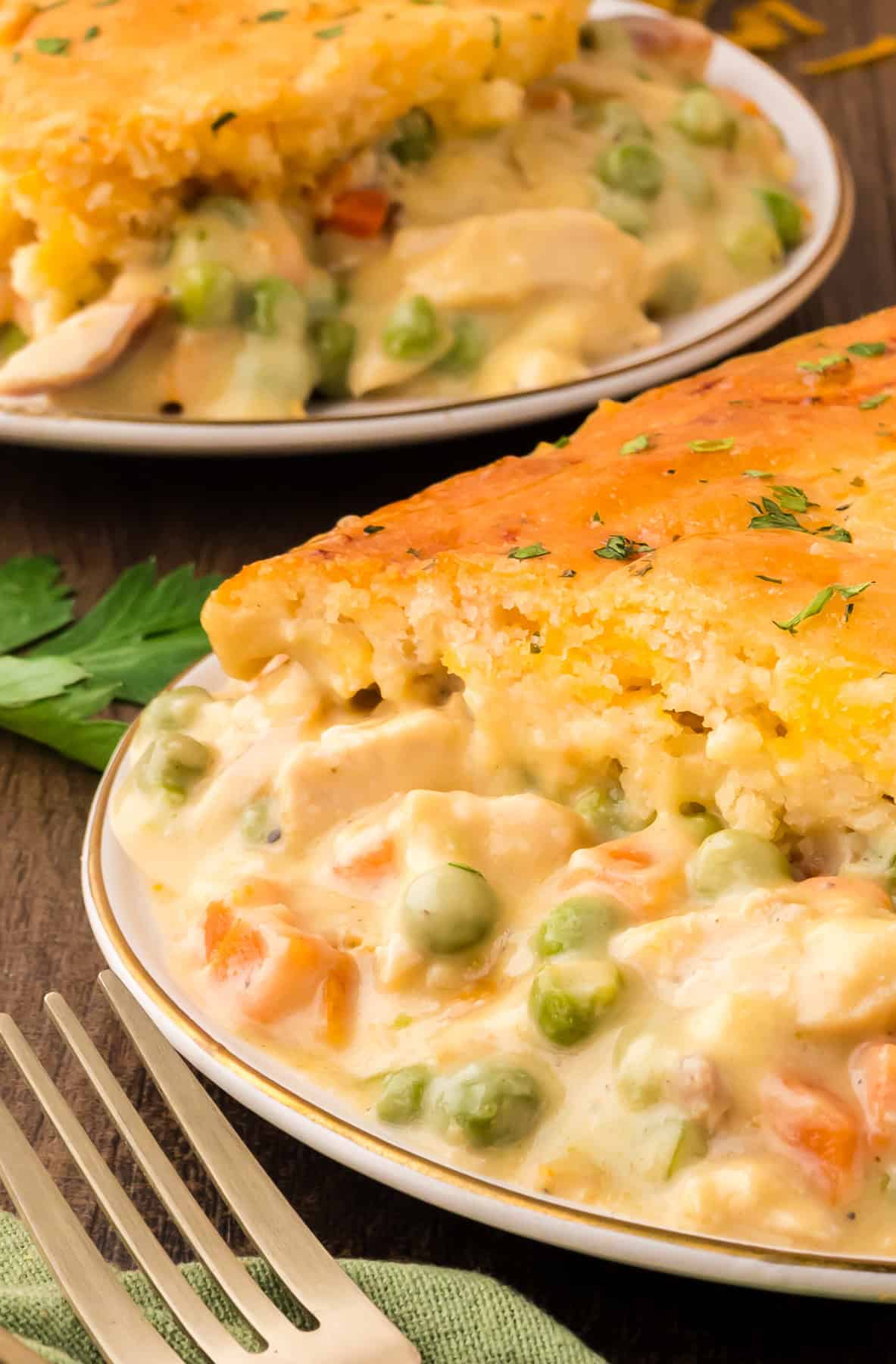 A plate full of chicken cobbler with Cheddar Bay biscuits