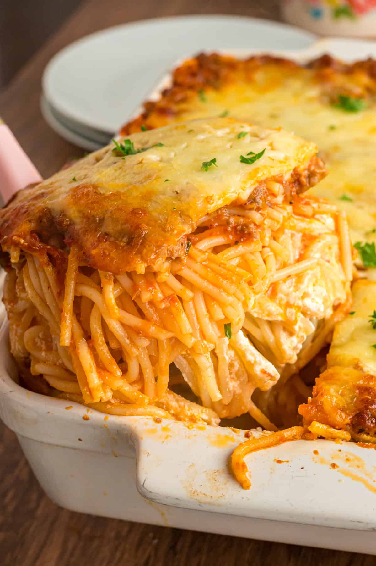 Serving baked million dollar spaghetti from the casserole dish