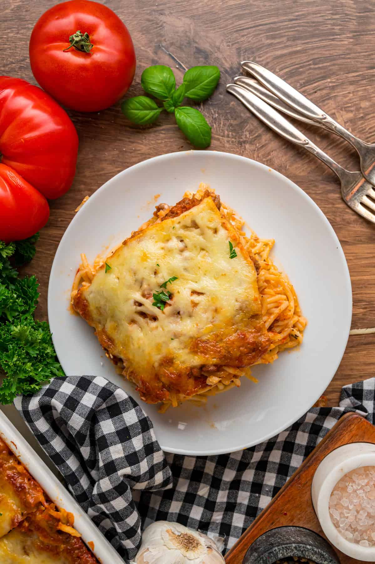 A slice of million dollar spaghetti casserole on a plate