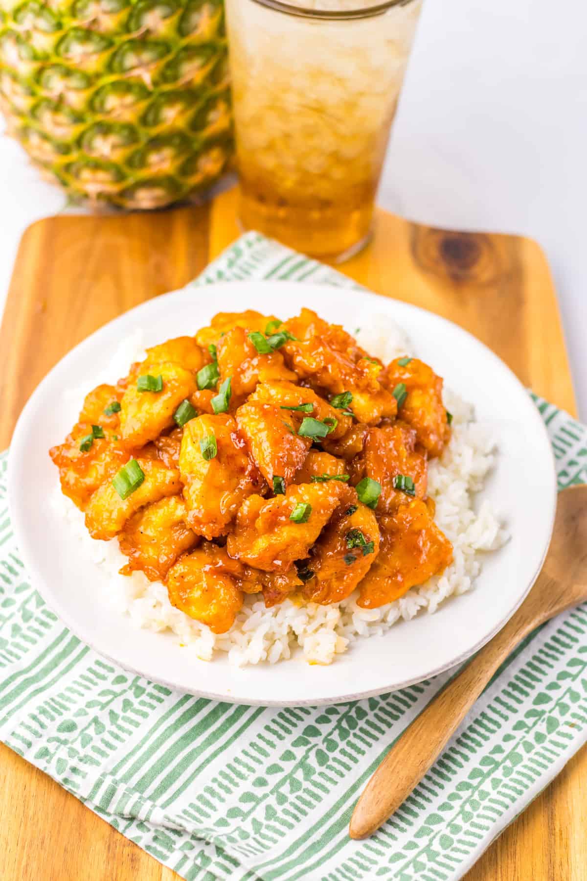 Slow Cooker Hawaiian Chicken served over white rice and garnished with green onions