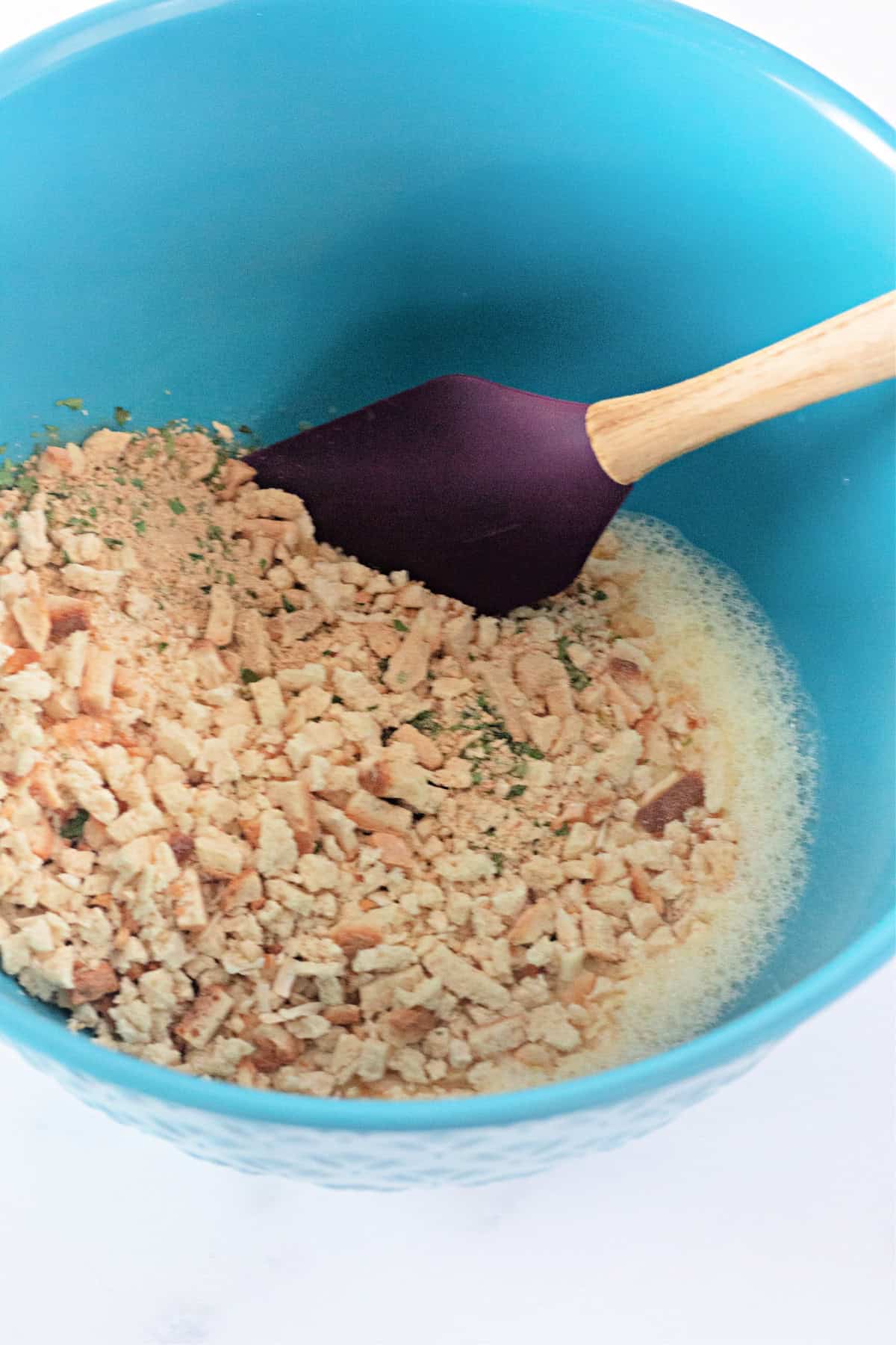 Stuffing mix in a mixing bowl to start a meatloaf recipe.