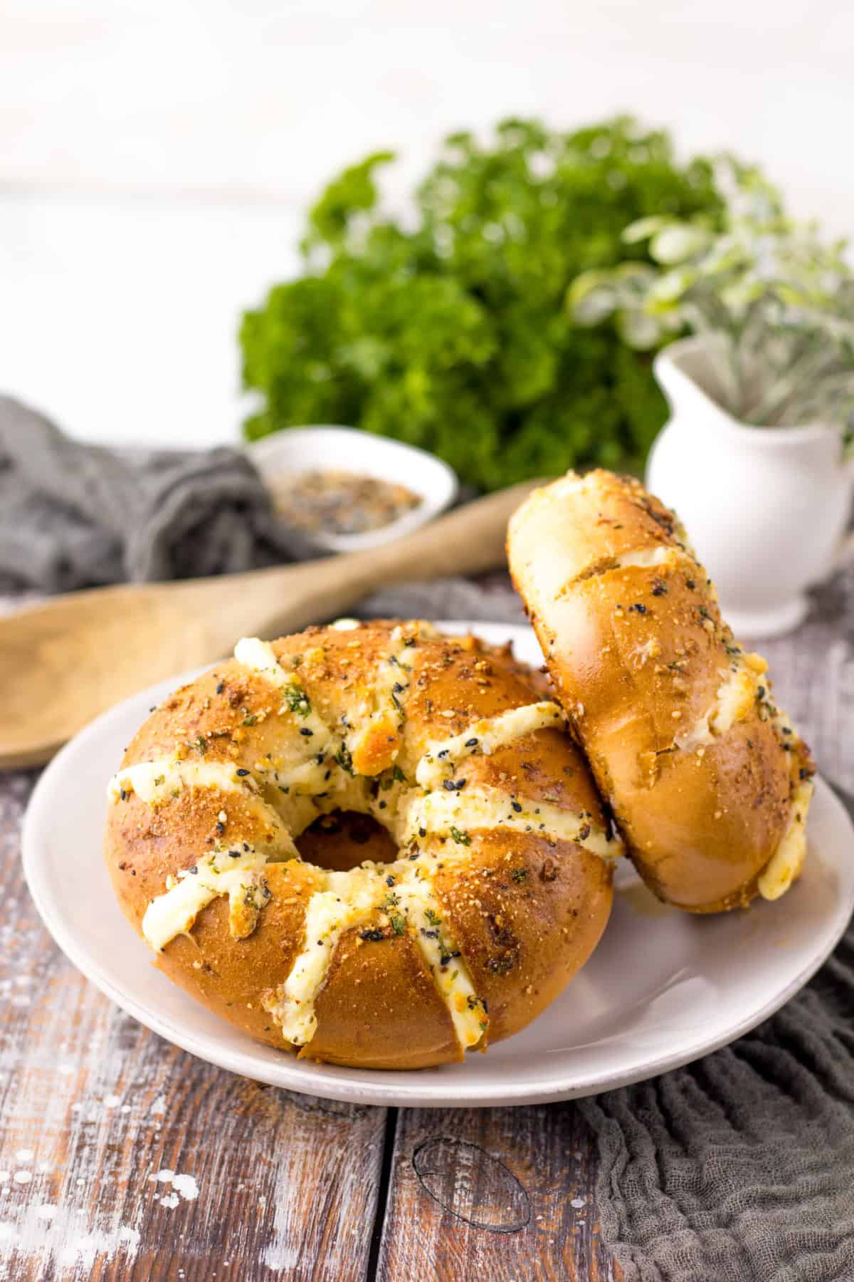 cream cheese stuffed bagels on white plate