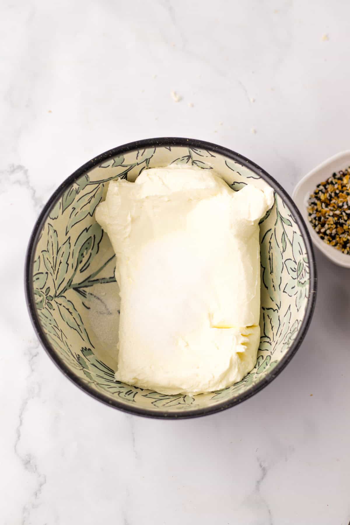 cream cheese in bowl for stuffed bagels