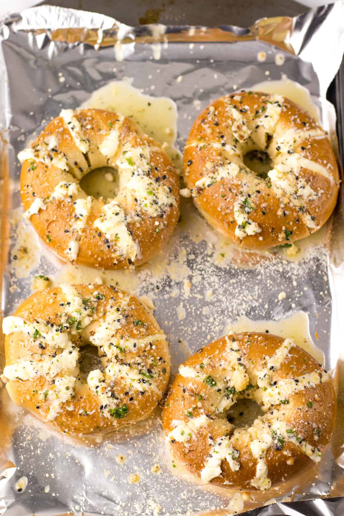 stuffed bagels on baking sheet ready for oven