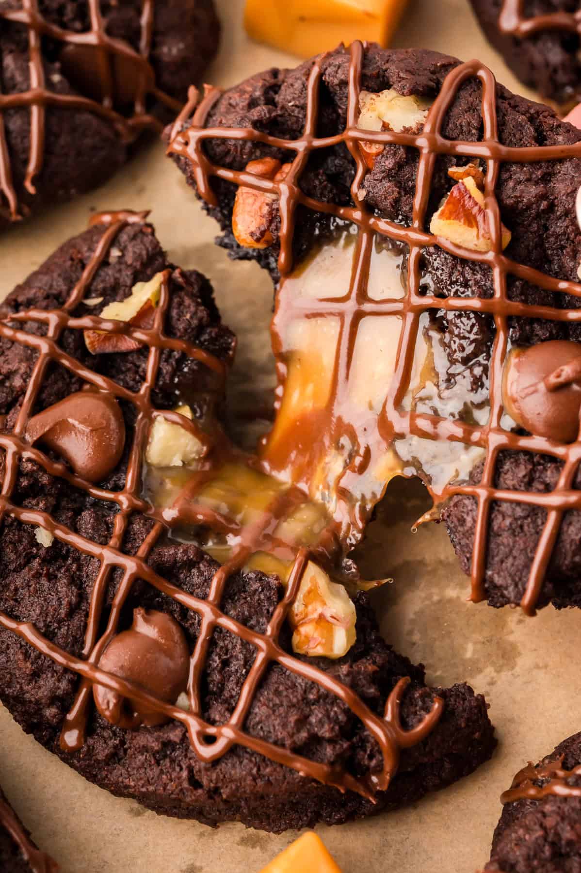 Pulling a turtle cookie apart to show the caramel inside